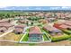 Expansive aerial view showcases the pool, patio, and clay tile roofs within the neighborhood at 2277 Bella Luna Cir, Lakeland, FL 33810