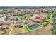 Wide aerial view of a home and the surrounding neighborhood showcasing numerous clay tiled roofs at 2277 Bella Luna Cir, Lakeland, FL 33810