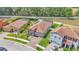 Wide angle aerial shows clay tile roofs, lush landscaping and neighborhood streets at 2277 Bella Luna Cir, Lakeland, FL 33810