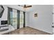 Light-filled bedroom features wood-look tile floors and a ceiling fan at 2277 Bella Luna Cir, Lakeland, FL 33810