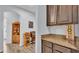 Hallway view of the office with built-in shelves and cabinetry on the right at 2277 Bella Luna Cir, Lakeland, FL 33810
