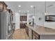 Gourmet kitchen with granite countertops, wooden cabinets and stainless steel appliances at 2277 Bella Luna Cir, Lakeland, FL 33810