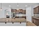Kitchen featuring granite countertops, stainless steel appliances, and wooden cabinets at 2277 Bella Luna Cir, Lakeland, FL 33810