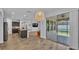 Open living space with eat-in kitchen, sliding glass doors leading to the outside patio at 2277 Bella Luna Cir, Lakeland, FL 33810