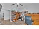 Office with hardwood floors, ceiling fan, french doors, desk and built-in bookcase at 2277 Bella Luna Cir, Lakeland, FL 33810