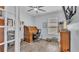 Office space featuring hardwood floors, ceiling fan and natural light from the window at 2277 Bella Luna Cir, Lakeland, FL 33810