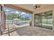 Spacious screened-in patio with a pool view, ceiling fan, and access to the backyard at 2277 Bella Luna Cir, Lakeland, FL 33810