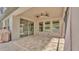 Covered patio with a ceiling fan, neutral colors, and tile flooring, perfect for relaxing outdoors at 2277 Bella Luna Cir, Lakeland, FL 33810