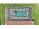 Aerial view features a screened-in pool and patio area with a clear view of the surrounding greenery at 2277 Bella Luna Cir, Lakeland, FL 33810