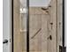 Close-up of a tiled shower with a hand-held sprayer and safety bar in the bathroom at 2277 Bella Luna Cir, Lakeland, FL 33810