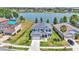 Stunning lakefront home featuring a manicured lawn, neutral exterior, and beautiful water views at 2468 Winnipeg Dr, Lakeland, FL 33805