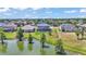 Aerial view of homes with backyard lake access and picturesque landscaping at 2468 Winnipeg Dr, Lakeland, FL 33805