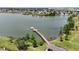 Aerial image of waterfront property with a long pier and a stunning lake view at 2468 Winnipeg Dr, Lakeland, FL 33805