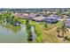 Aerial view of residential neighborhood with lake, mature trees, and well-maintained lawns at 2468 Winnipeg Dr, Lakeland, FL 33805