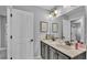 Bathroom features double sinks, vanity, stylish hardware, and decorative wall art at 2468 Winnipeg Dr, Lakeland, FL 33805