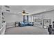 Bright bonus room features a window seat, ceiling fan, and neutral decor at 2468 Winnipeg Dr, Lakeland, FL 33805