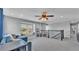 Bright bonus room features a window seat and staircase with iron railing at 2468 Winnipeg Dr, Lakeland, FL 33805