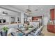The dining room features a modern light fixture, seating for six and an open floor plan with access to the kitchen at 2468 Winnipeg Dr, Lakeland, FL 33805