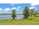 Scenic lake view with trees and a charming lakeside landscape at 2468 Winnipeg Dr, Lakeland, FL 33805