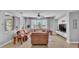 Spacious living room features tile floors, large windows with lake views, and comfortable furniture at 2468 Winnipeg Dr, Lakeland, FL 33805