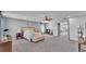 Spacious main bedroom with sitting area, carpet, and access to another room at 2468 Winnipeg Dr, Lakeland, FL 33805