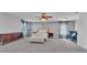 Spacious main bedroom features neutral decor, carpet, and a ceiling fan at 2468 Winnipeg Dr, Lakeland, FL 33805