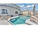 Relaxing screened-in pool area with sun loungers and seating, perfect for entertaining at 2468 Winnipeg Dr, Lakeland, FL 33805