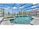 Relaxing screened pool and spa with cascading waterfalls and serene lake views at 2468 Winnipeg Dr, Lakeland, FL 33805
