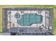 Aerial view of backyard pool with lounge chairs, landscaping and screened in enclosure at 2468 Winnipeg Dr, Lakeland, FL 33805