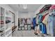 Organized walk-in closet with shelving, hanging rods, and plenty of storage space for clothes and accessories at 2468 Winnipeg Dr, Lakeland, FL 33805