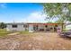 Large backyard with covered patio perfect for outdoor seating and entertaining at 2520 Avenue C Sw, Winter Haven, FL 33880