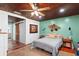 Bedroom boasting a wood plank ceiling, and an accent wall complemented by modern furnishings at 2520 Avenue C Sw, Winter Haven, FL 33880
