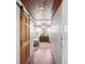 Hallway view of the bedroom showcasing hardwood floors, a ceiling fan, and a chest of drawers at 2520 Avenue C Sw, Winter Haven, FL 33880