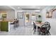 Eat-in kitchen area features a breakfast bar, dining table, and French doors leading to the backyard at 2520 Avenue C Sw, Winter Haven, FL 33880
