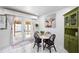 Eat-in kitchen area features a dining table and unique decor with a view to the backyard at 2520 Avenue C Sw, Winter Haven, FL 33880