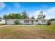 Charming single-story home with a well-maintained lawn and attached garage at 2520 Avenue C Sw, Winter Haven, FL 33880