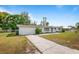Inviting single-story home with a long driveway and attached garage at 2520 Avenue C Sw, Winter Haven, FL 33880
