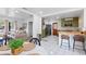 Open concept living and eat-in kitchen area with stainless steel appliances and breakfast bar seating at 2520 Avenue C Sw, Winter Haven, FL 33880