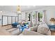Bright living room boasts natural light, comfortable seating, and stylish decor at 2520 Avenue C Sw, Winter Haven, FL 33880