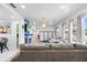Open-concept living room with tiled floors, a fireplace, and comfortable furnishings at 2520 Avenue C Sw, Winter Haven, FL 33880