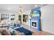 Cozy living room features a decorative fireplace and open floor plan to kitchen at 2520 Avenue C Sw, Winter Haven, FL 33880