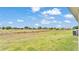 Spacious backyard with lush green grass, perfect for outdoor enjoyment at 2611 San Marco Way, Winter Haven, FL 33884