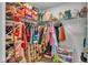 Walk-in closet fully stocked with an array of clothes, shoes, and accessories, offering plenty of storage at 2611 San Marco Way, Winter Haven, FL 33884
