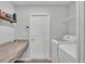 Functional laundry room with counter space, storage, and modern appliances at 2611 San Marco Way, Winter Haven, FL 33884