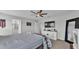 Comfortable main bedroom featuring a large bed, ensuite bathroom access, and walk-in closet for ample storage at 2611 San Marco Way, Winter Haven, FL 33884