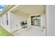 Covered patio with barbecue grill, great for outdoor dining and relaxing at 2611 San Marco Way, Winter Haven, FL 33884