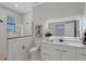 Modern bathroom with a glass-enclosed shower, elegant vanity, and illuminated mirror, creating a spa-like retreat at 2645 Delphi Hills Ct, Lakeland, FL 33812