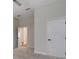 Bright bedroom with neutral walls, carpet, and white doors, offering a calming and modern aesthetic at 2645 Delphi Hills Ct, Lakeland, FL 33812