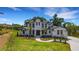 An exterior view shows the home's front facade, with a sidewalk, grass lawn, and landscaping at 2645 Delphi Hills Ct, Lakeland, FL 33812