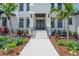 Elegant entrance with double doors and attractive landscaping at 2645 Delphi Hills Ct, Lakeland, FL 33812